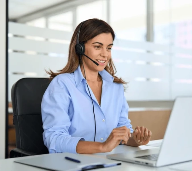 A girl; at customer support talking to a customer