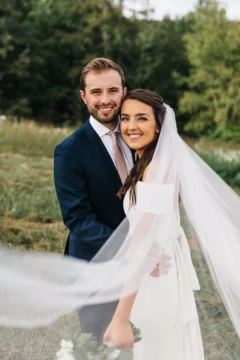 Newly Married couple taking picture in garden