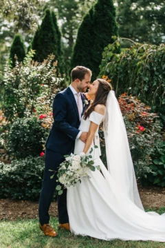 Newly Married couple taking picture in garden